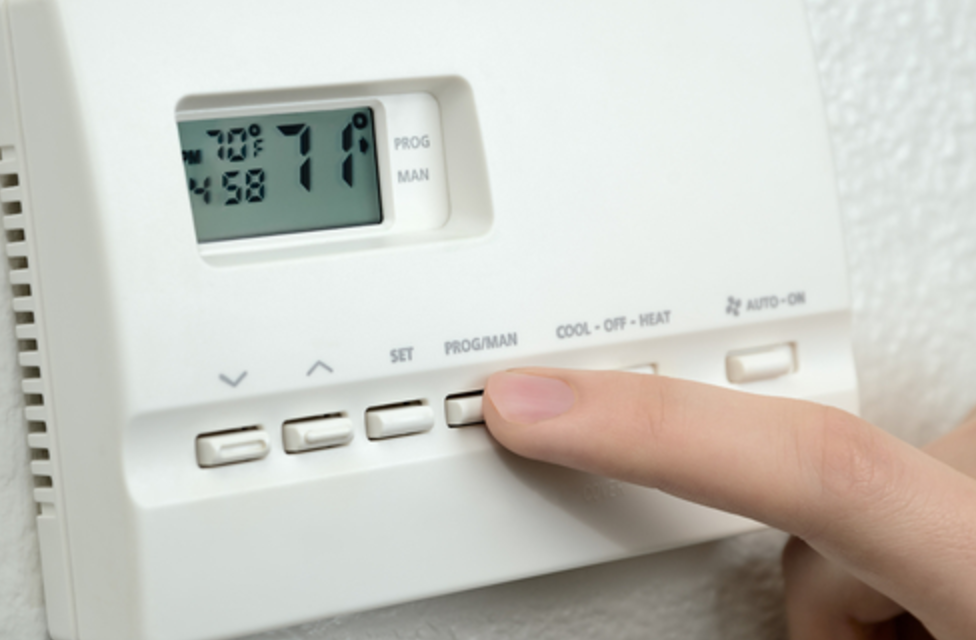 ac checklist for columbia missouri shown as a programmable thermostat